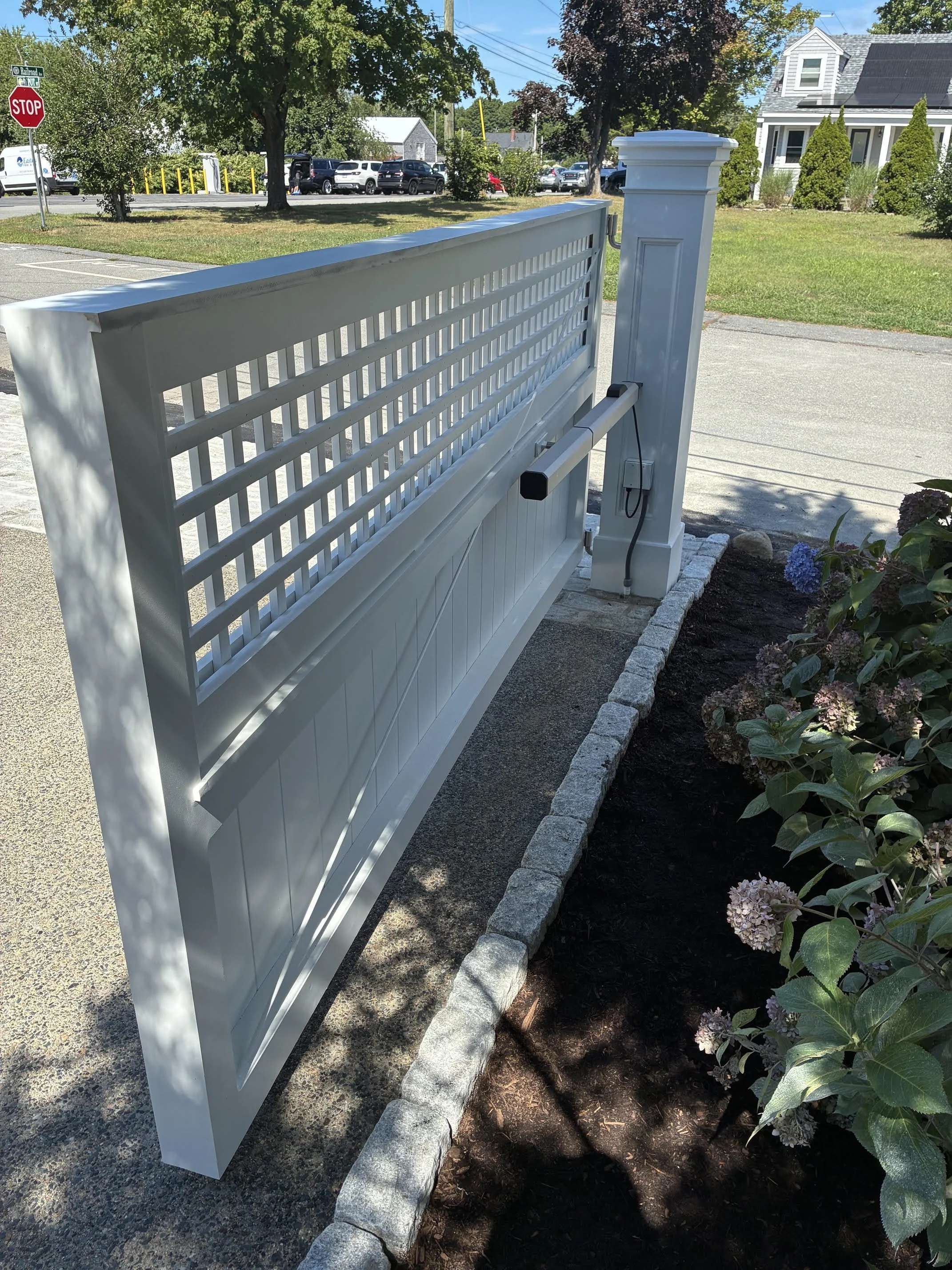 Security camera mounted on a residential gate fence