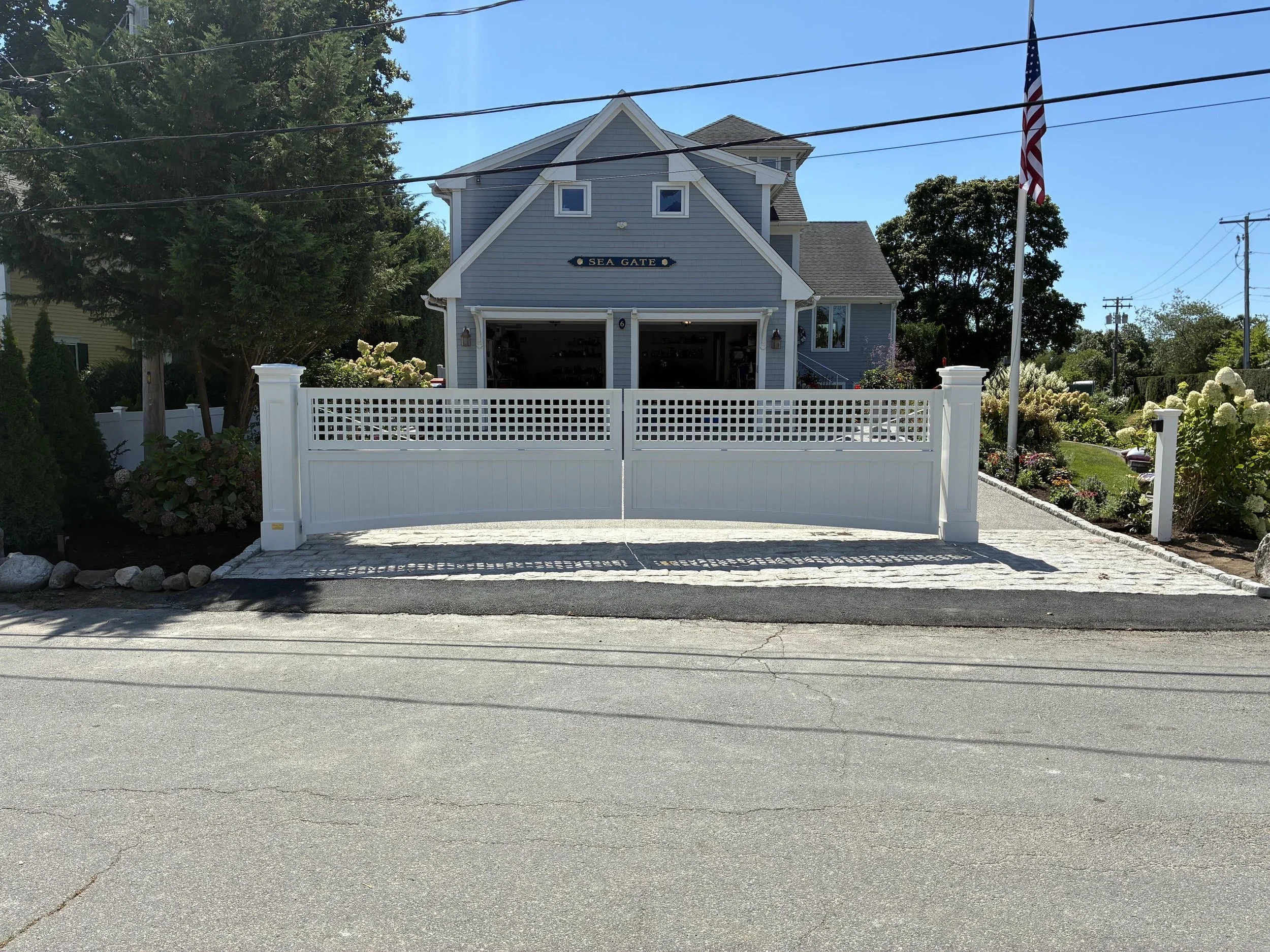Automated gate on a New England home