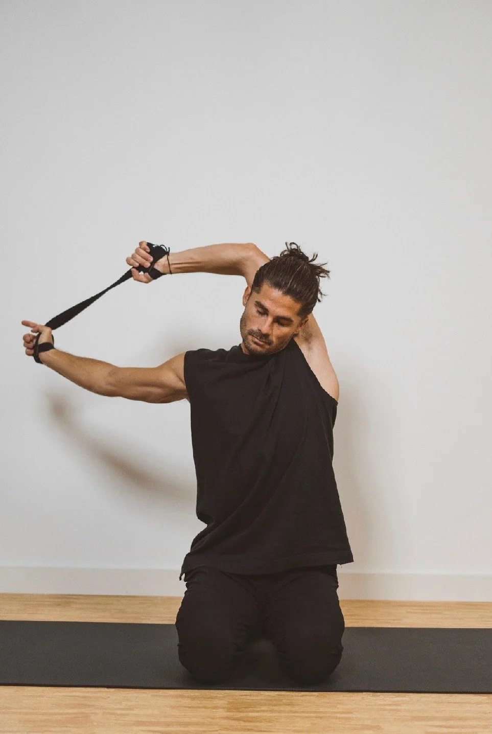 Taylor Garrison practicing a full body stretch during a personalized movement session