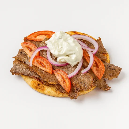 Lamb gyro sandwich with tomato slices, red onion, and tzatziki sauce on pita bread.