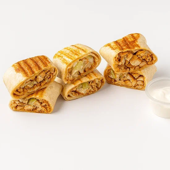 Four chicken wraps with grilled marks and a side of dipping sauce on a white background.