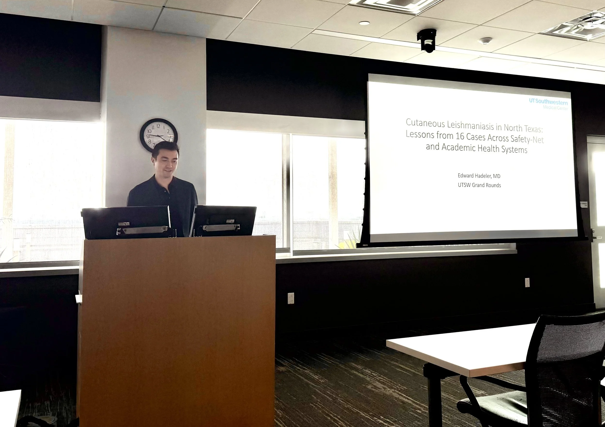 Dr. Edward K. Hadeler presenting dermatology research at UT Southwestern Grand Rounds.