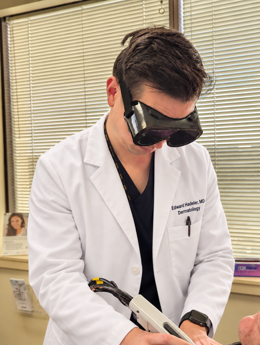 Dr. Edward K. Hadeler performing a laser treatment during a dermatology cosmetic visit.