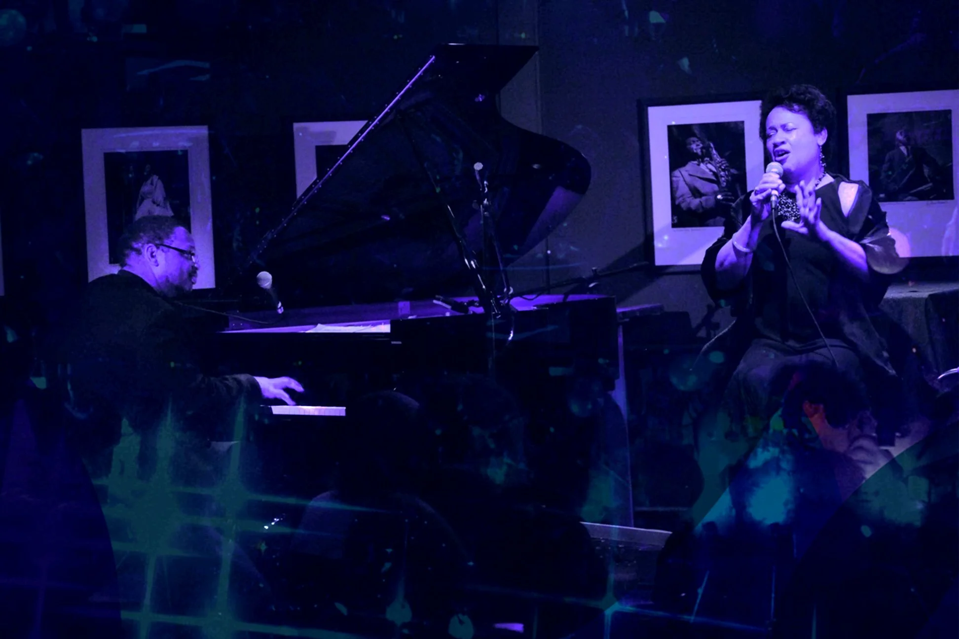 Mardra Thomas singing and Reggie Thomas playing piano at an intimate jazz club performance.