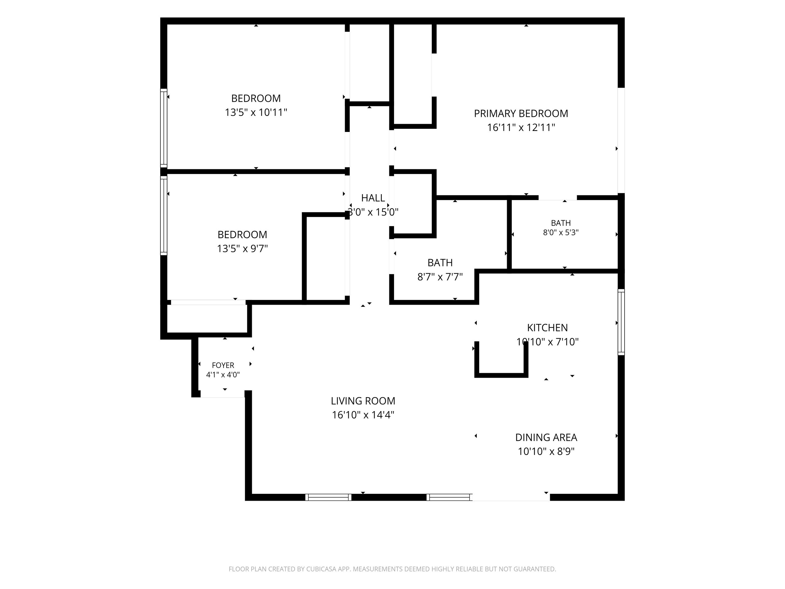 Floor plan of a house showing rooms such as foyer, living room, dining area, kitchen, hall, bedrooms, and bathrooms with their respective dimensions.