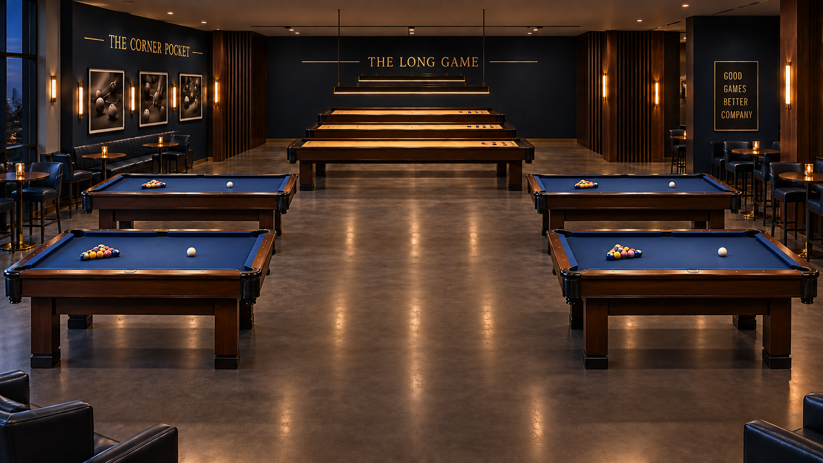 A modern billiards room with four pool tables, each with a set of balls arranged for a game, in a stylish, dimly lit lounge area featuring dark walls, artwork, and wooden accents.
