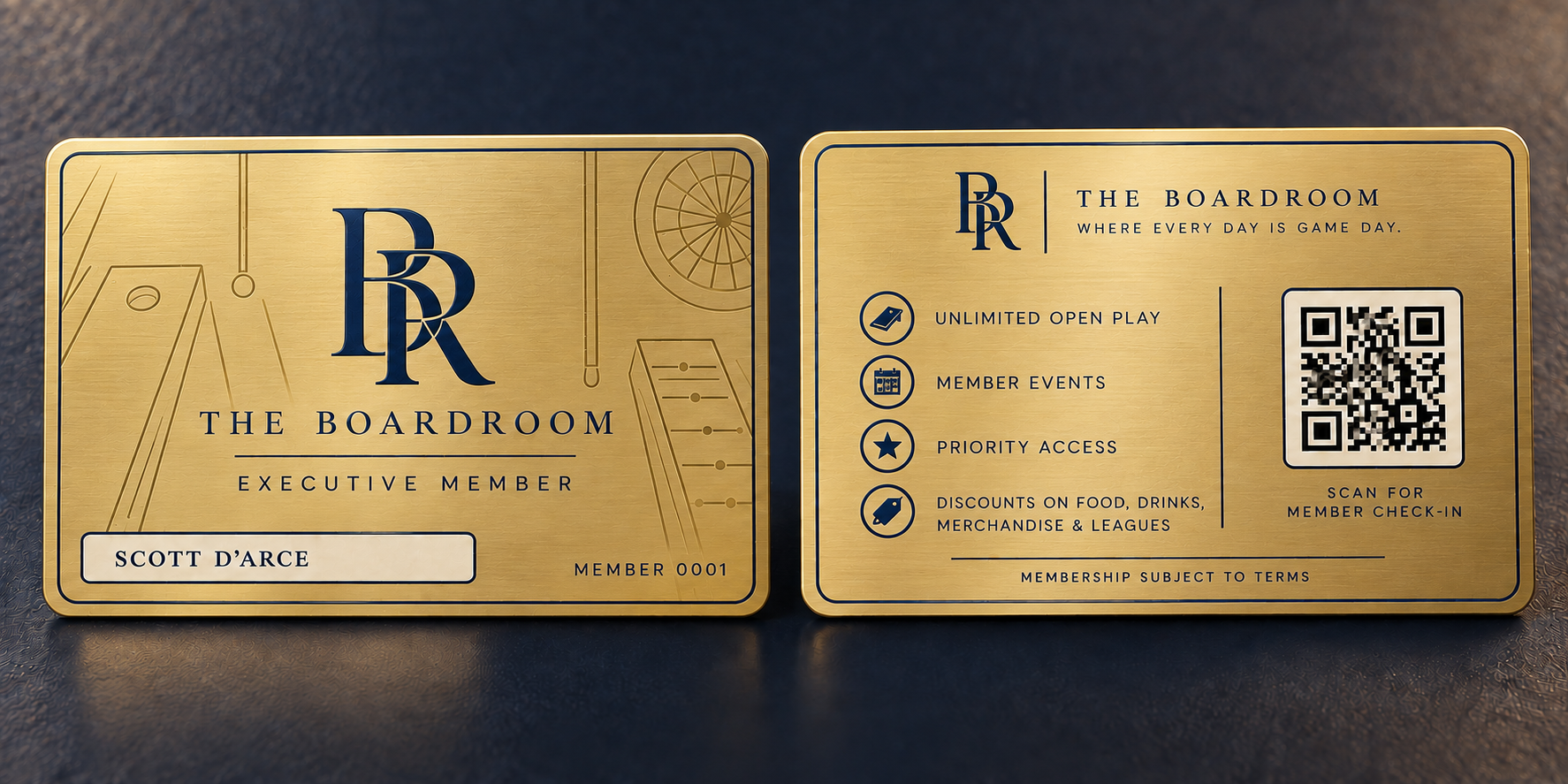 Gold membership card with blue initials 'BR' and the words 'The Boardroom Executive Member' on the front. The back of the card lists benefits including unlimited open play, member events, priority access, discounts on food, drinks, merchandise, and leagues, and includes a QR code for member check-in.