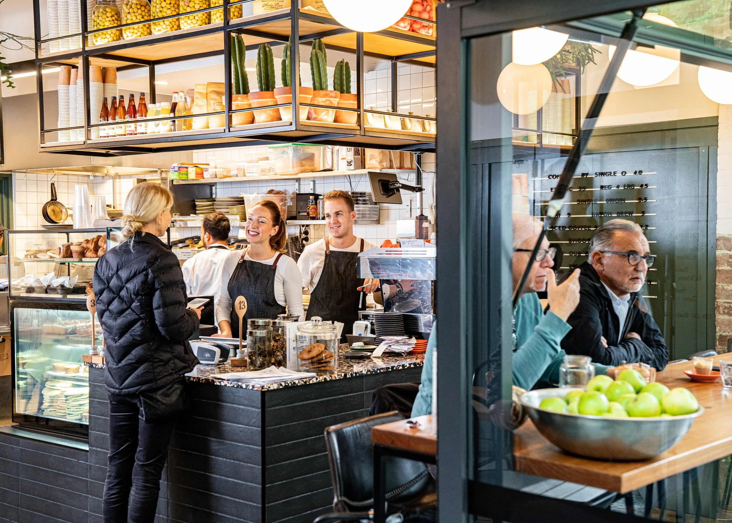 Woman ordering coffee at counter