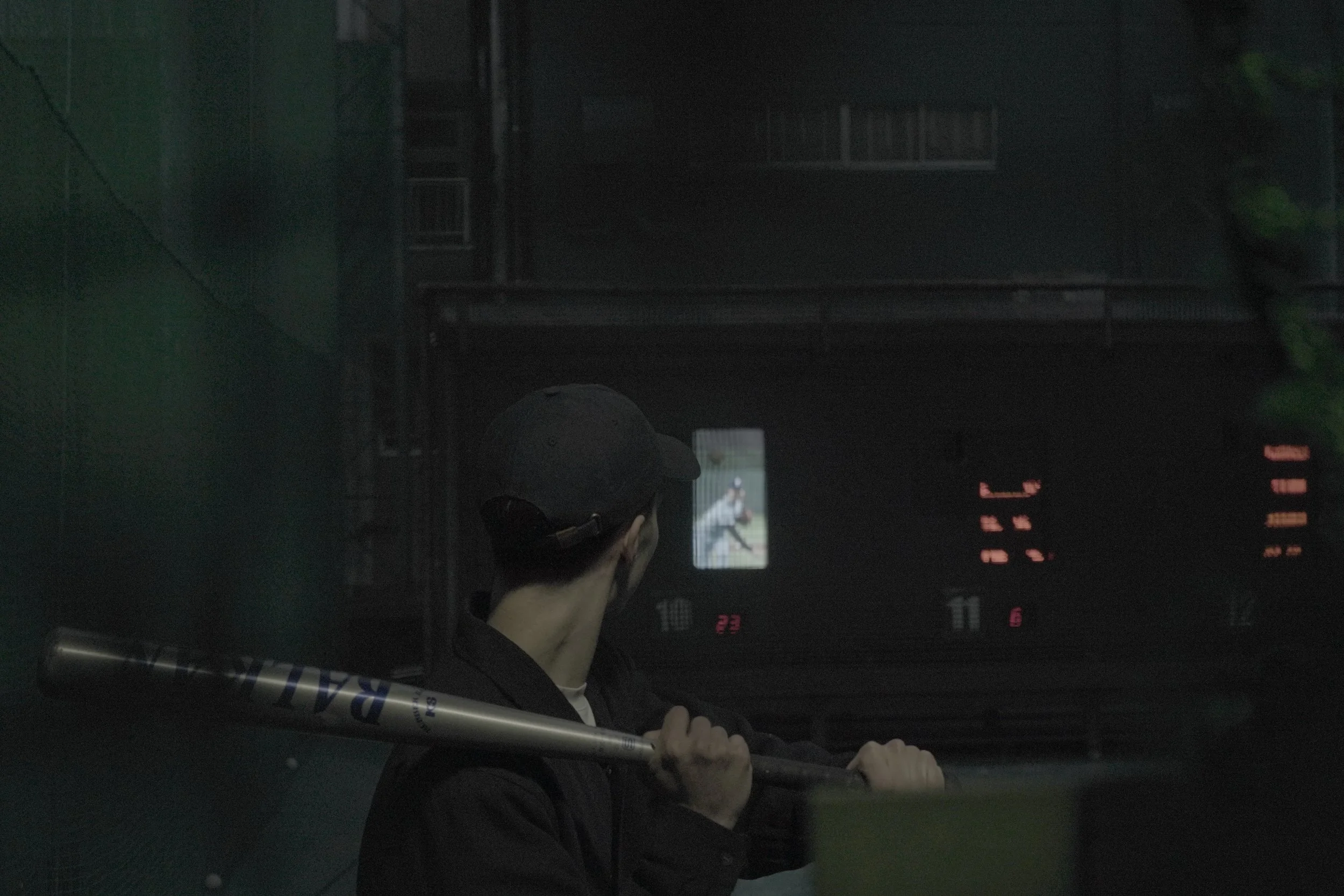 Person holding a baseball bat.
