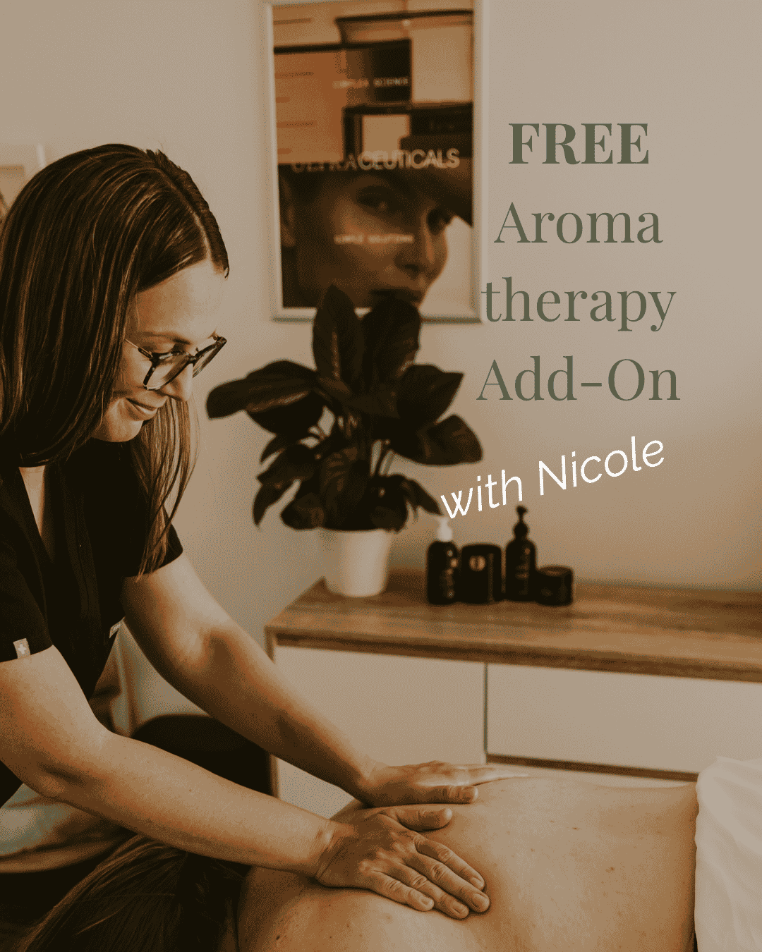 massage to a person lying face down on a massage table in a wellness room.  advertising free aroma therapy add-on with Nicole.