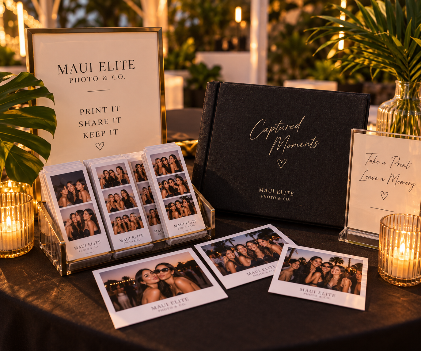 Personalized photo booth prints and keepsakes displayed at a Maui event