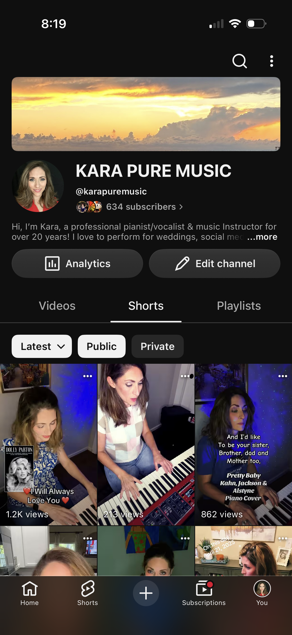 Screenshot of a YouTube channel page called "KARA PURE MUSIC" featuring a profile photo of a woman with shoulder-length brown hair, wearing a red top. The page displays videos with thumbnail images, titles, and viewer counts.