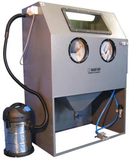 A sandblasting cabinet with gloves, viewing window, and vacuum system for abrasive cleaning.