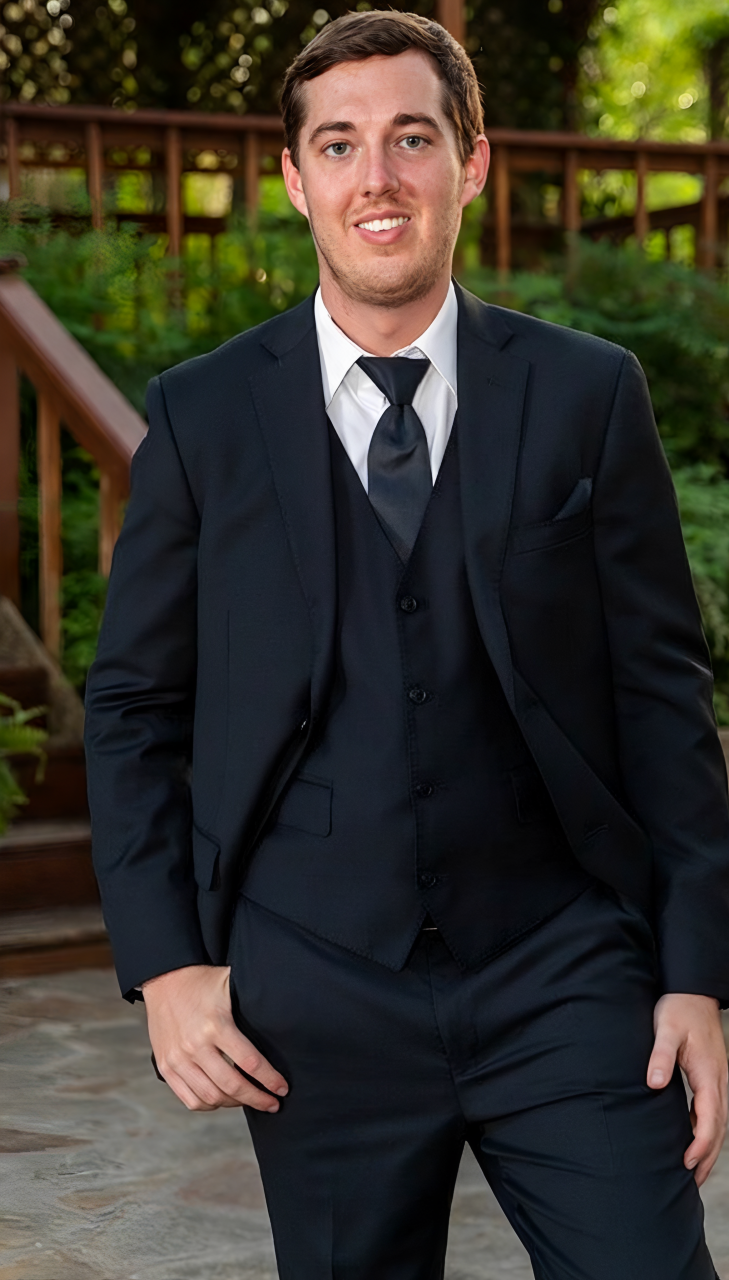Portrait of Korbin Black, founder of Kompliance Food Safety Consulting, in a suit