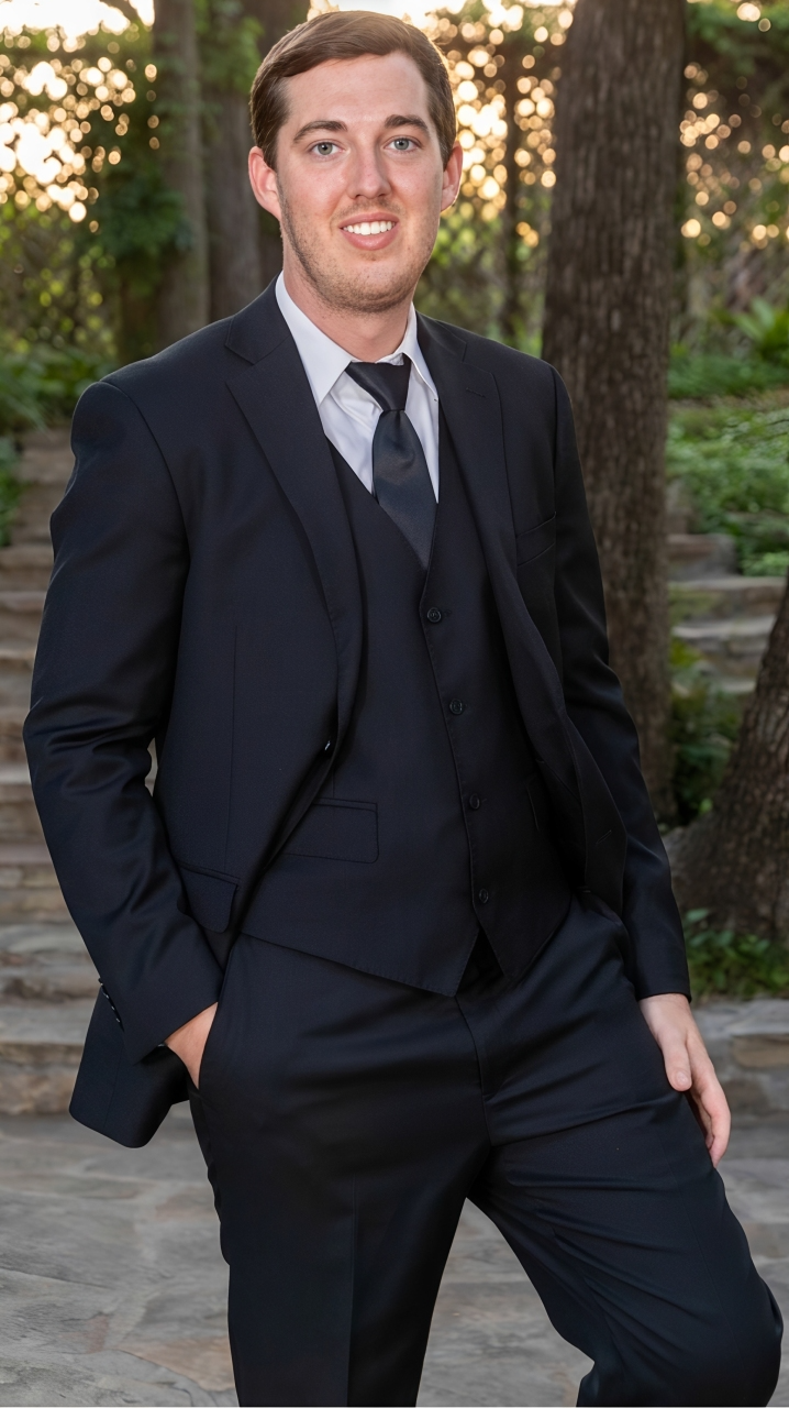 Korbin Black, founder of Kompliance Food Safety Consulting, smiling outdoors
