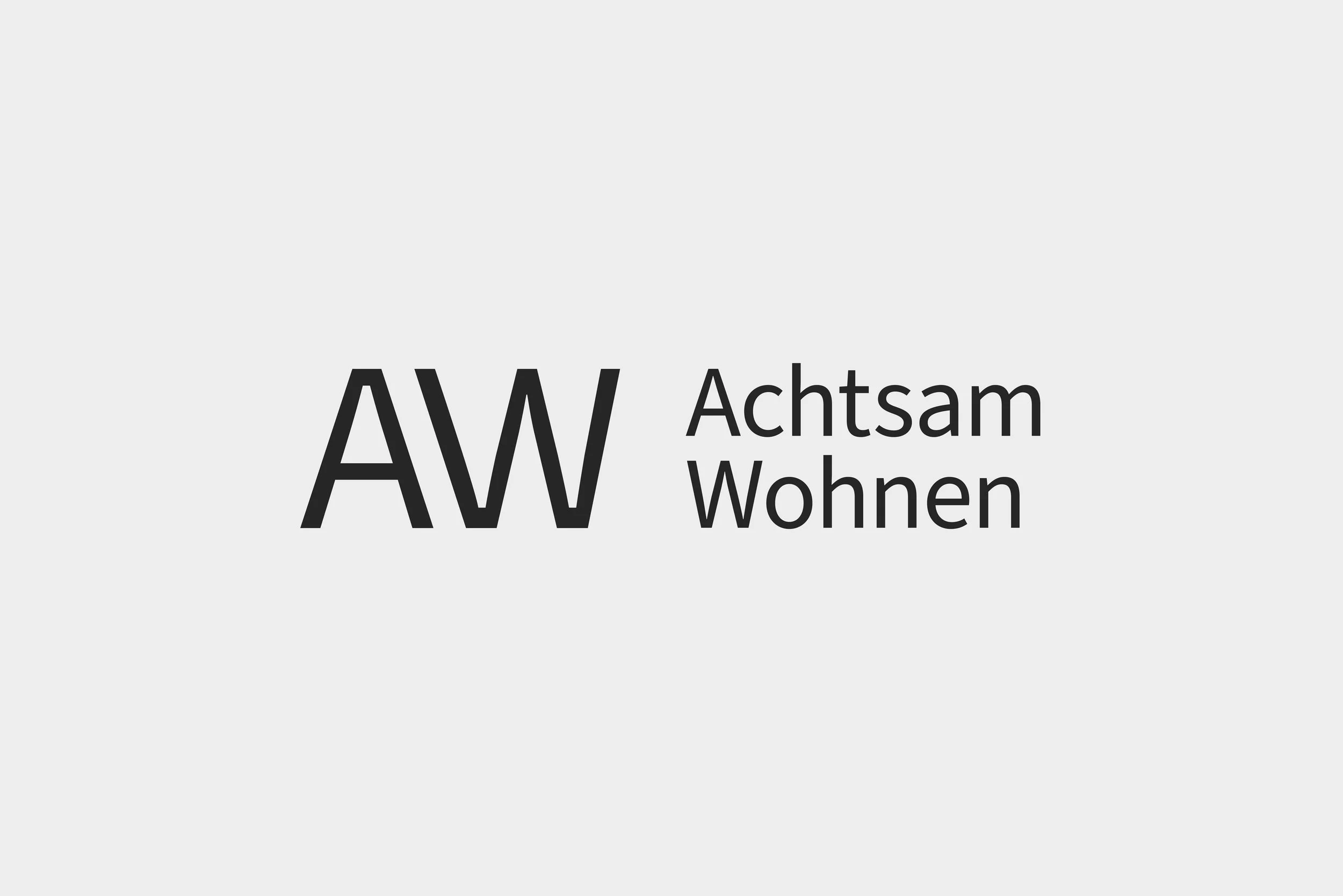 Logo mit den Buchstaben 'AW' und dem Text 'Achtsam Wohnen' in schwarz auf hellem Hintergrund.