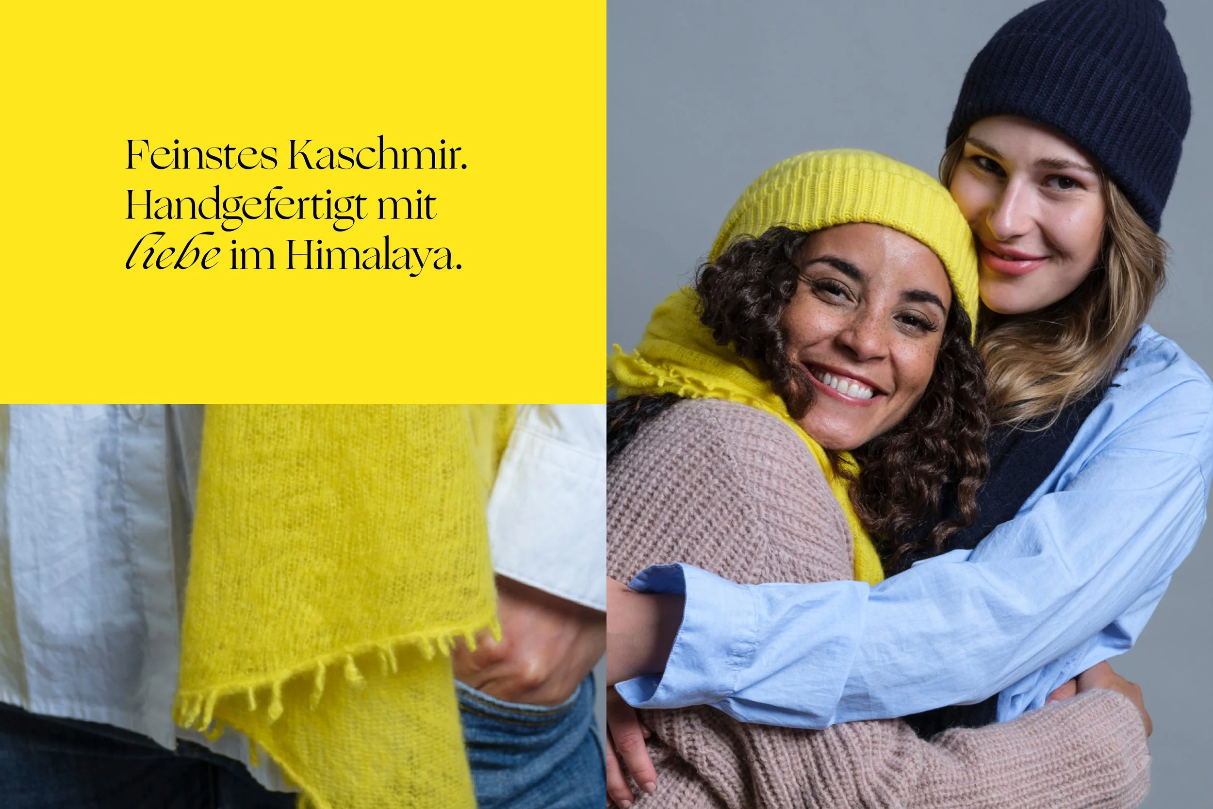 Zwei Frauen, die sich umarmen, lachen und tragen bunte Mützen, eine gelbe und eine blaue, vor einem grauen Hintergrund.