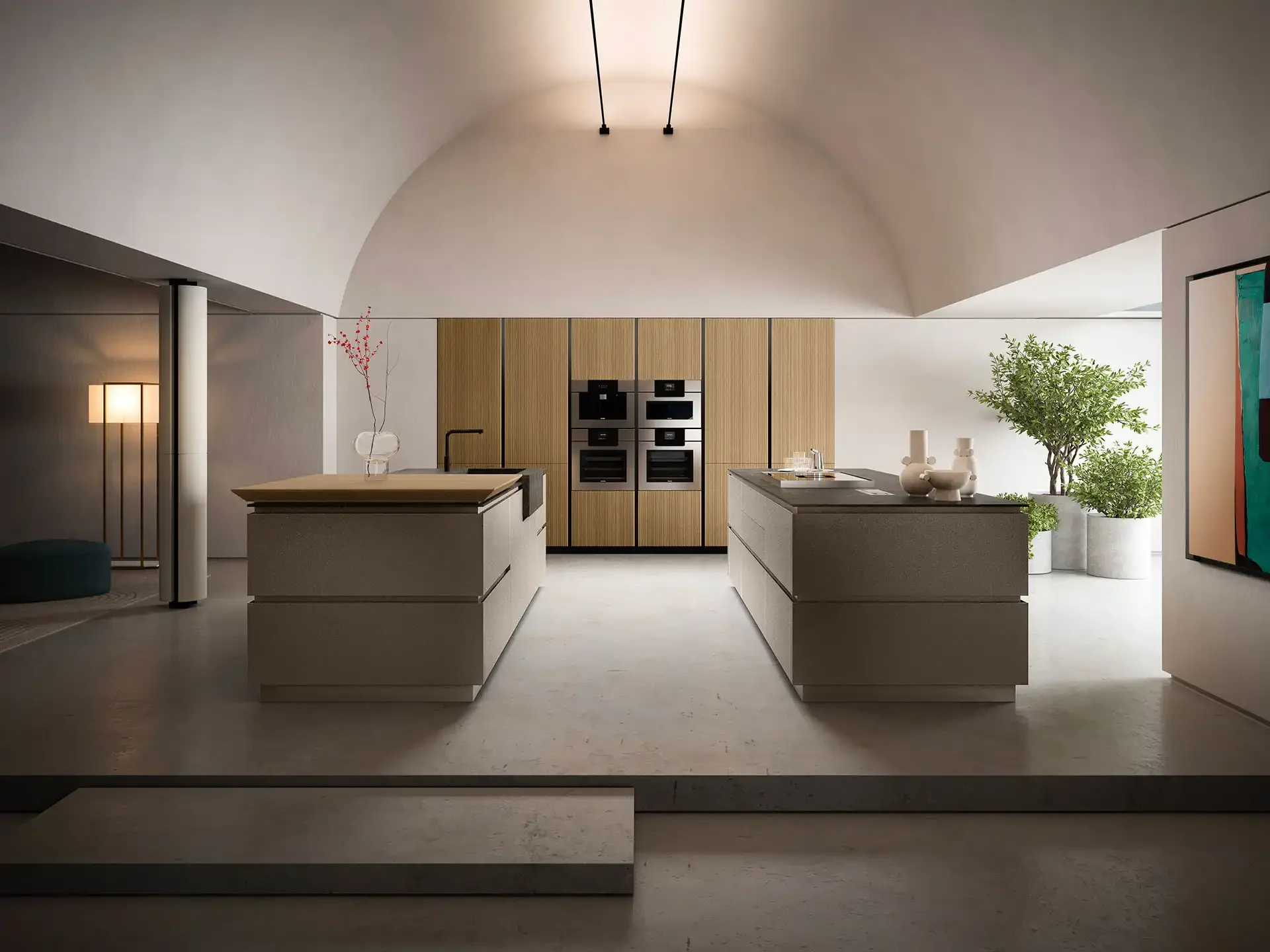 Modern kitchen with white countertops, a central island, wooden cabinets, built-in oven and microwave, green plants, and artwork on the wall.