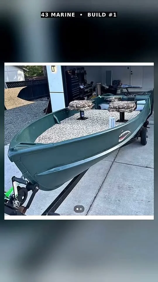 Build 01: green 14-foot Starcraft with deck and seats on a trailer