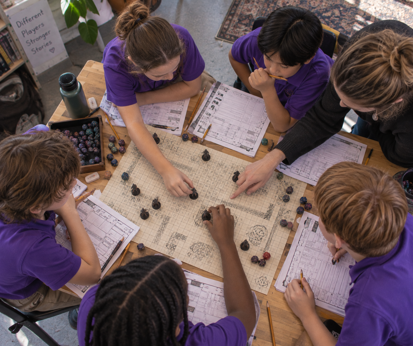 Group of children in purple shirts playing tabletop role-playing game with a grid map and miniatures, guided by an adult. They are seated around a table with character sheets and dice. Part of KINHALL's after-school tabletop roleplaying program.