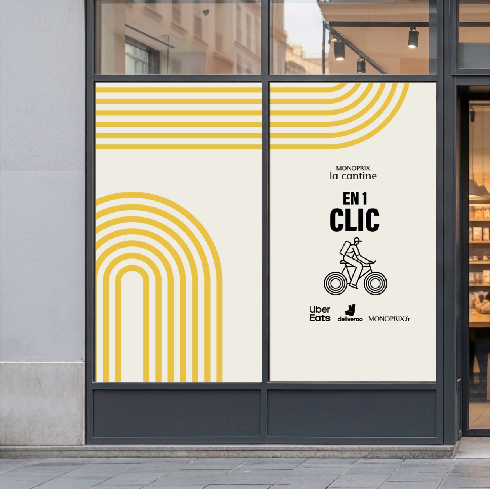 Vitrine de la cantine Monoprix habillée d'arcs jaunes, message « En 1 clic » et logos de livraison