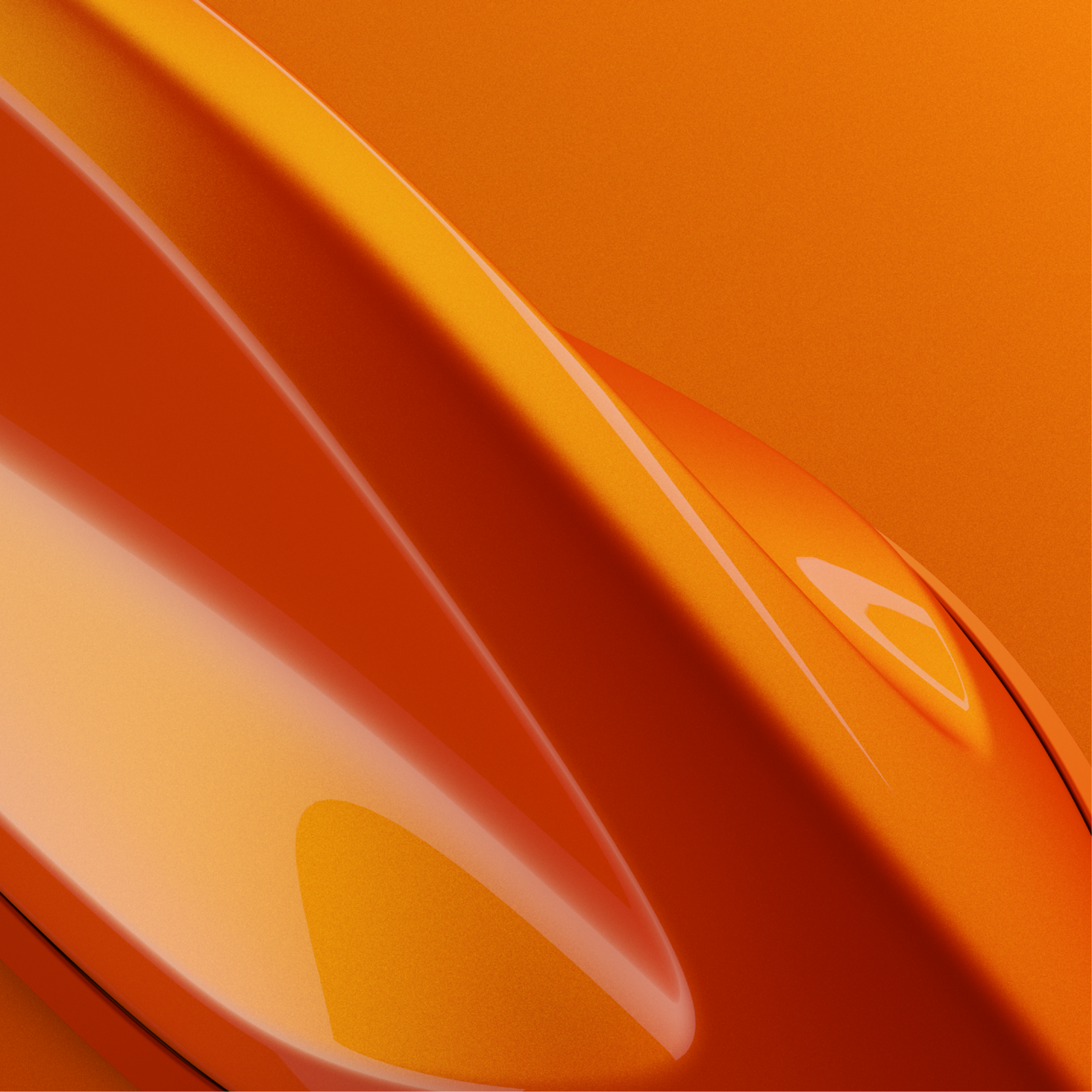 Photographie macro des courbes brillantes d'une carrosserie Renault orange
