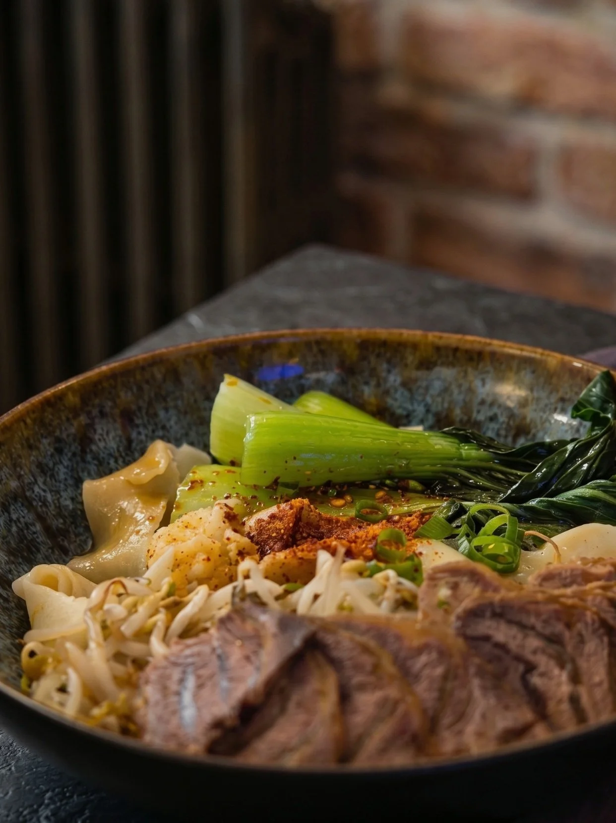 Have you tried our signature Oil Spiced Noodles yet? 🍜

You (油) = sizzling hot oil
Po (泼) = splashed over fragrant garlic, scallions, and chili flakes
Mian (面) = perfectly chewy, freshly hand-pulled noodles

Our Oil Spiced Noodle is for those who cr