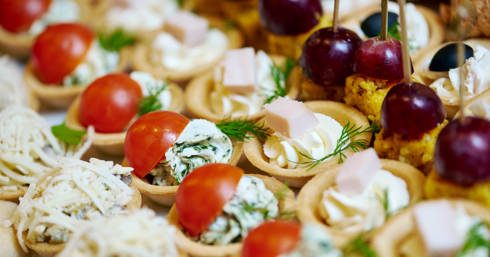 Savoury tartlets and bite-sized food arranged for a buffet