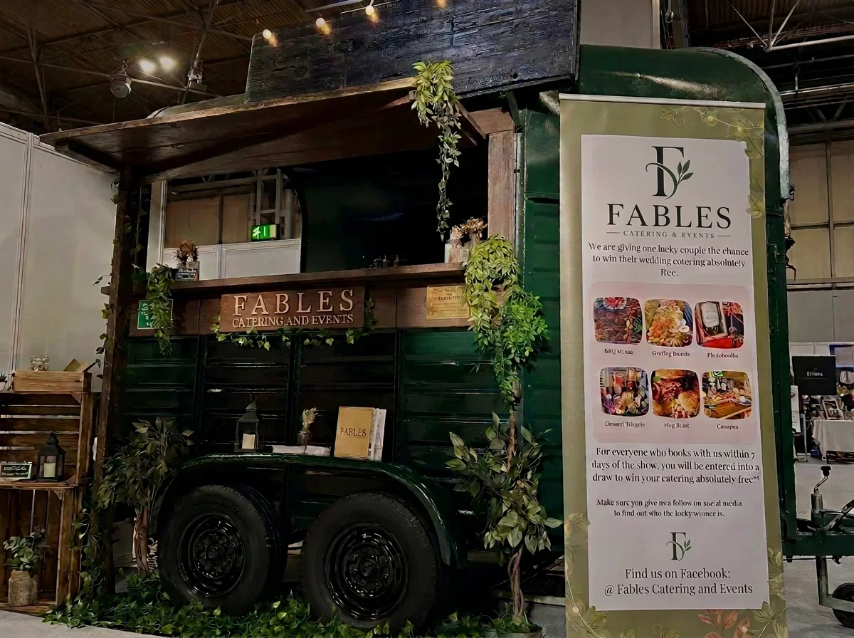 Fables vintage catering horsebox with company signage at an indoor exhibition