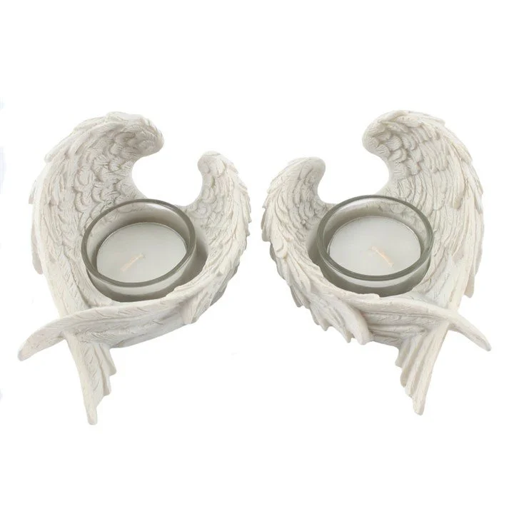 Set of 2 Winged Candle Holders (top).jpg
