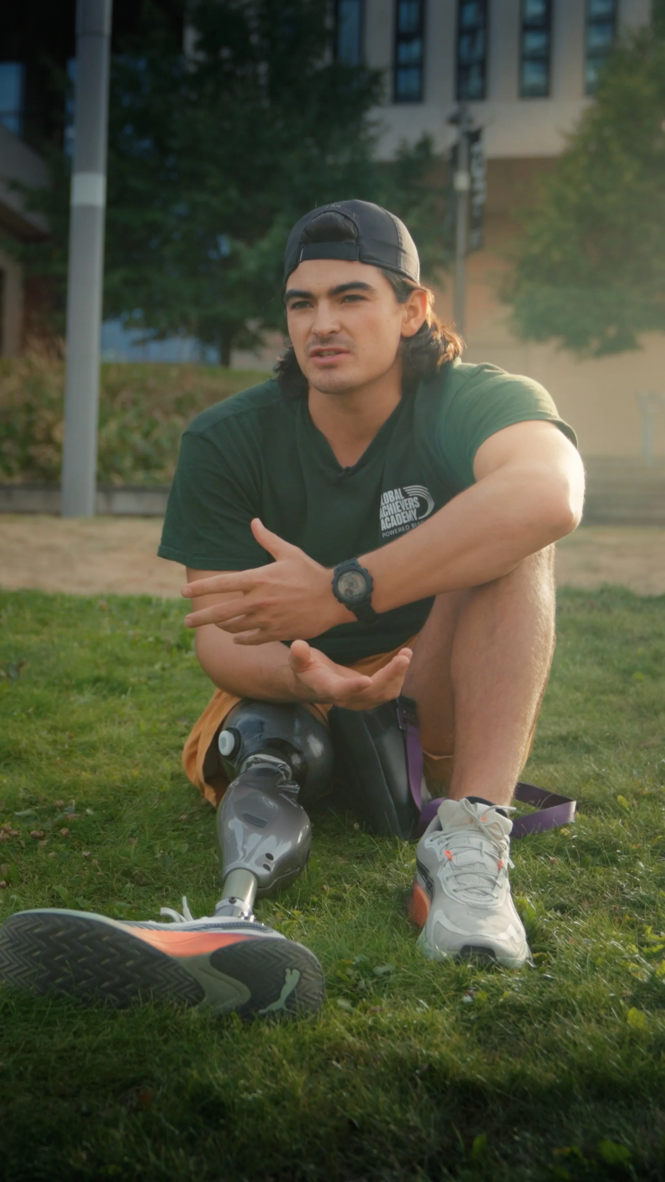 A staff member sitting for a video testimonial describing his passion for teaching.
