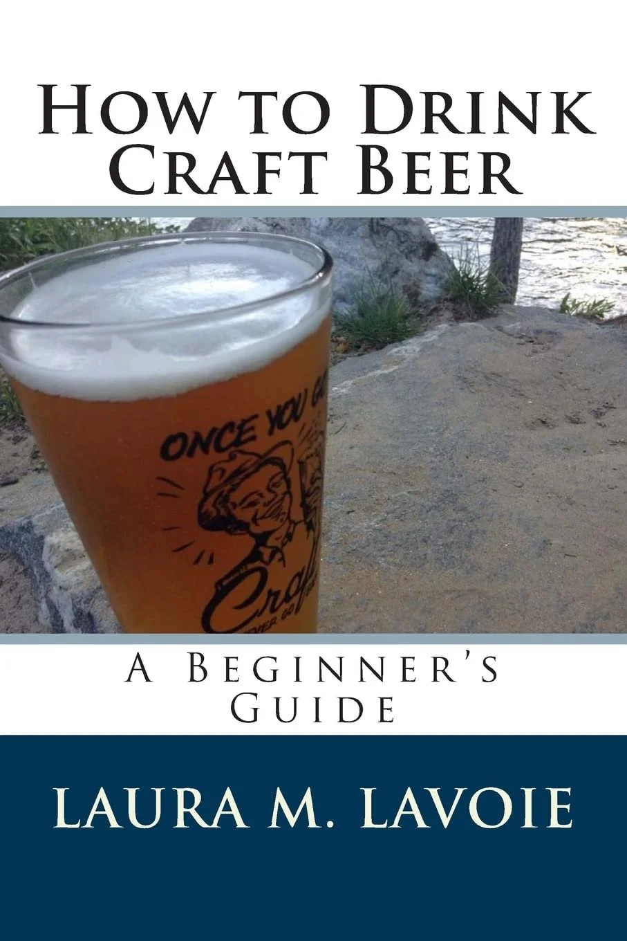 Book cover titled 'How to Drink Craft Beer: A Beginner's Guide' by Laura M. LaVoie, featuring a glass of craft beer outdoors with a scenic background.