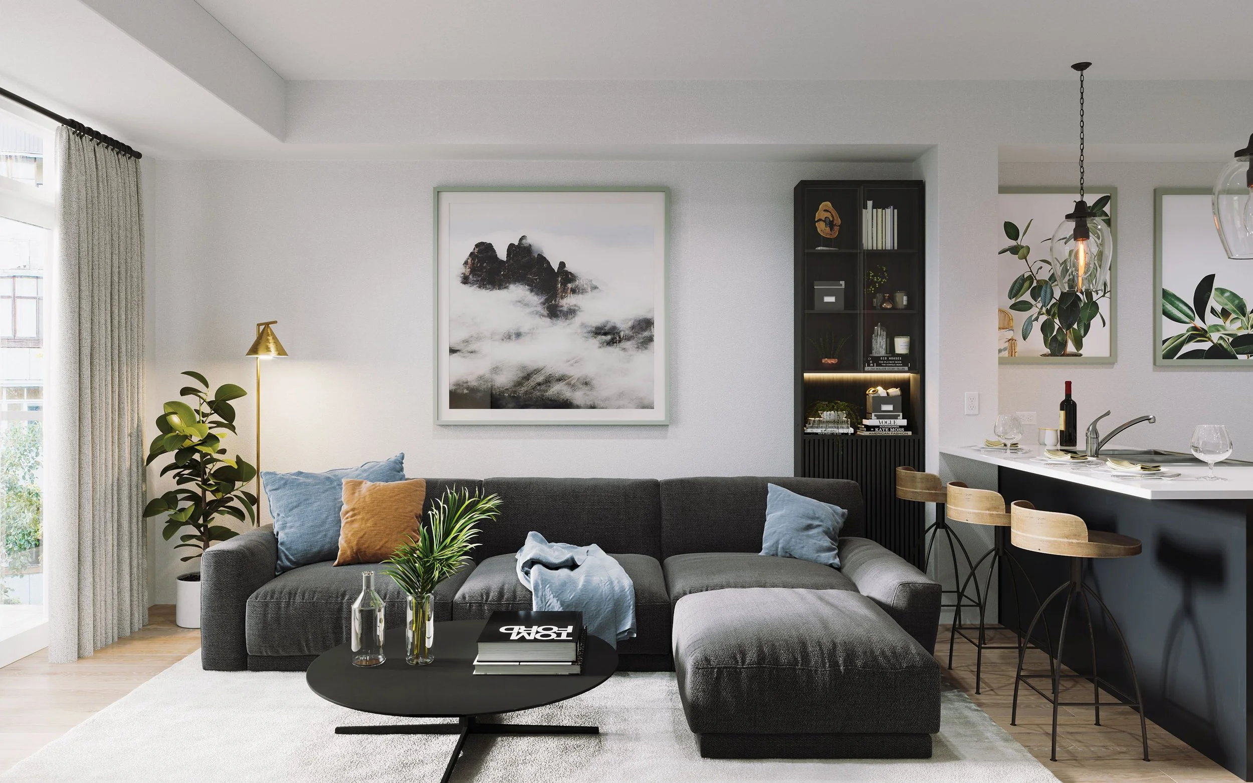 A modern living room with a gray sofa adorned with colorful pillows, a black coffee table with vases and books, and artwork of mountains and sea on the walls. A black bookshelf, a potted plant, and large windows with curtains are also visible.