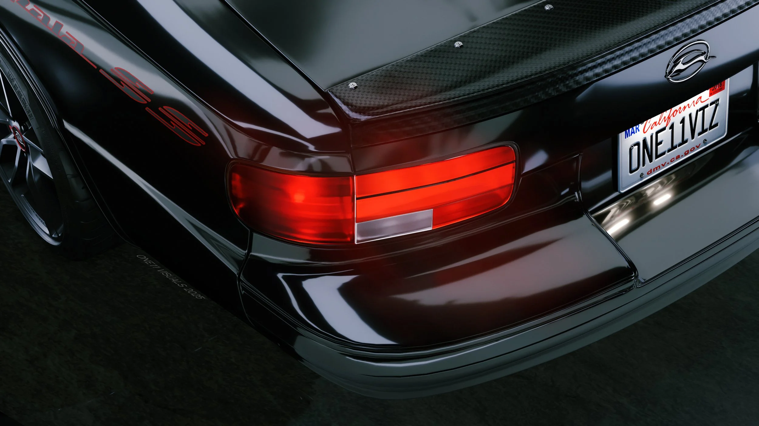 Close-up of the rear of a black sports car, showing tail lights, a badge, and a license plate with California registration.