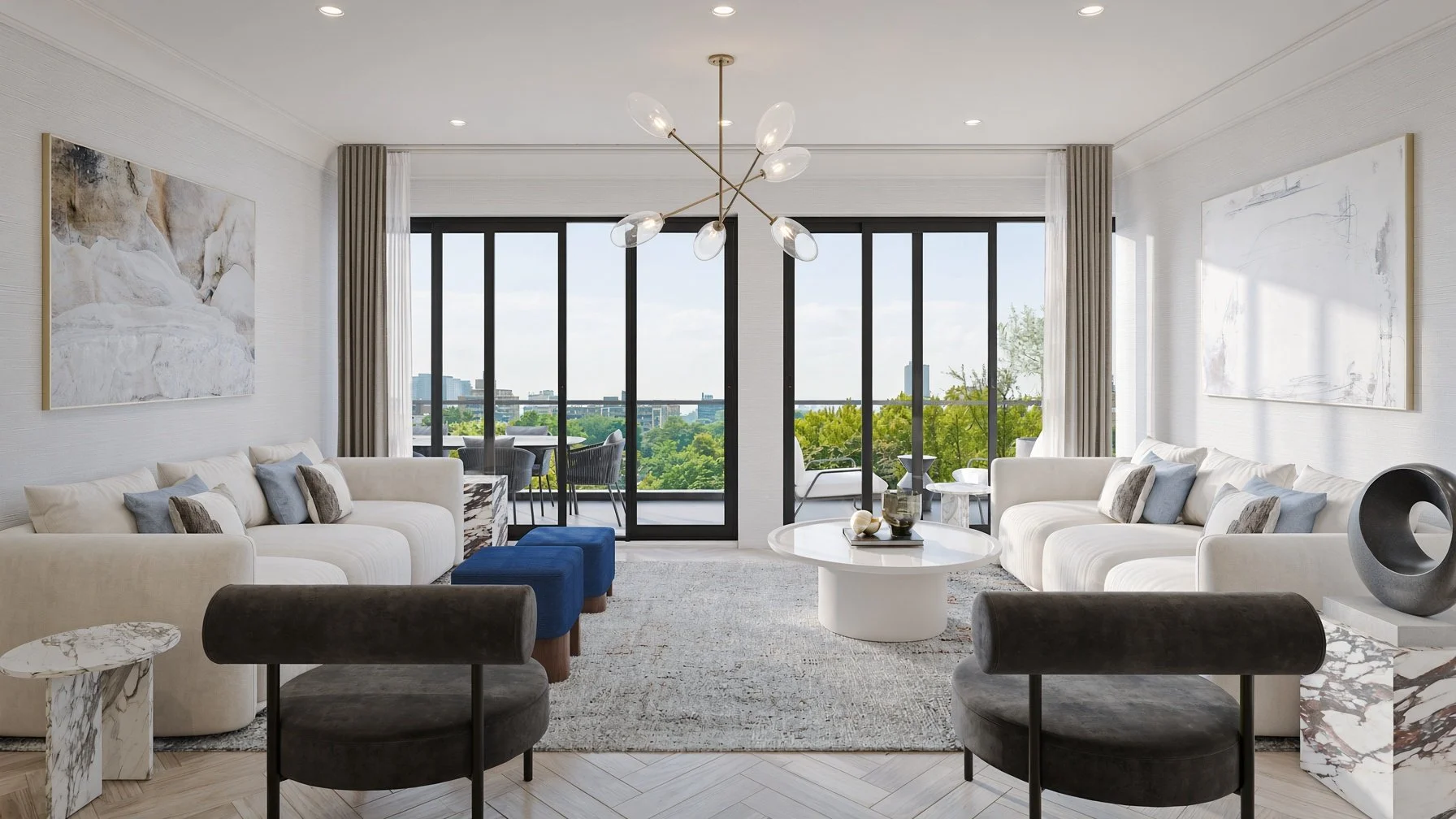 Modern living room with white sofas, black and gray chairs, a round white coffee table, artwork on white walls, large glass doors leading to a balcony with outdoor seating, and a city view with trees in the background.