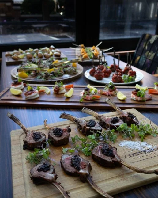 An assortment of appetizers on a table at Conversate Steak & Seafood in Hamilton.