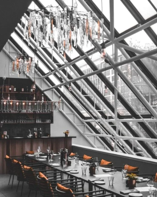 Conversate Steak & Seafood in Hamilton's event space with a large glass ceiling.