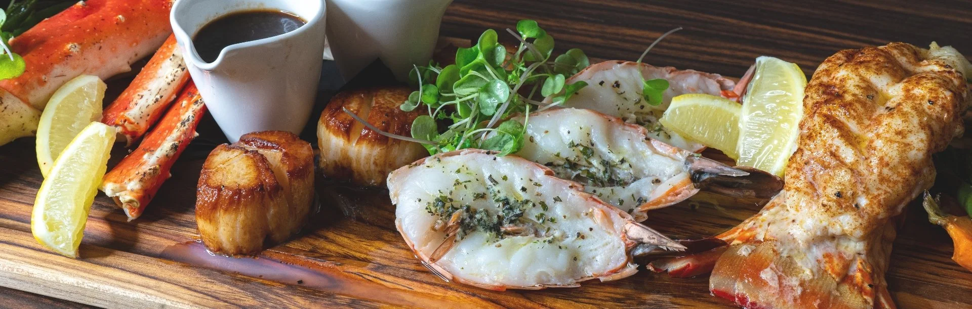Seafood platter on a wooden board.