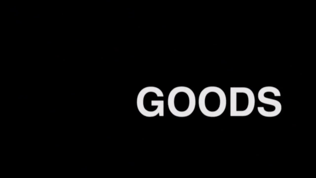 Black background with the word 'GOODS' in large, white letters.