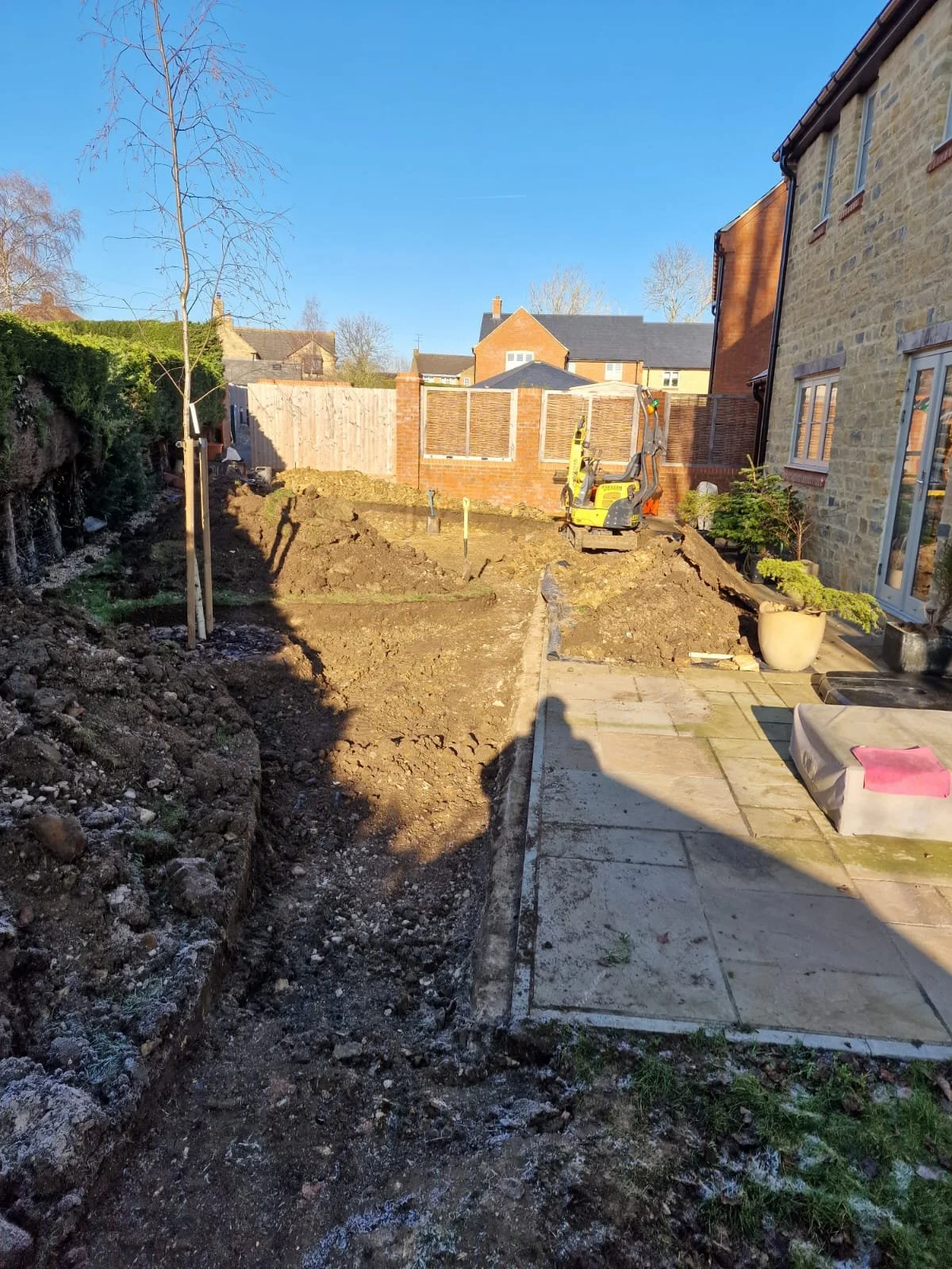 Patio Extension & Stone Wall Retention in Milton Keynes — photo 1