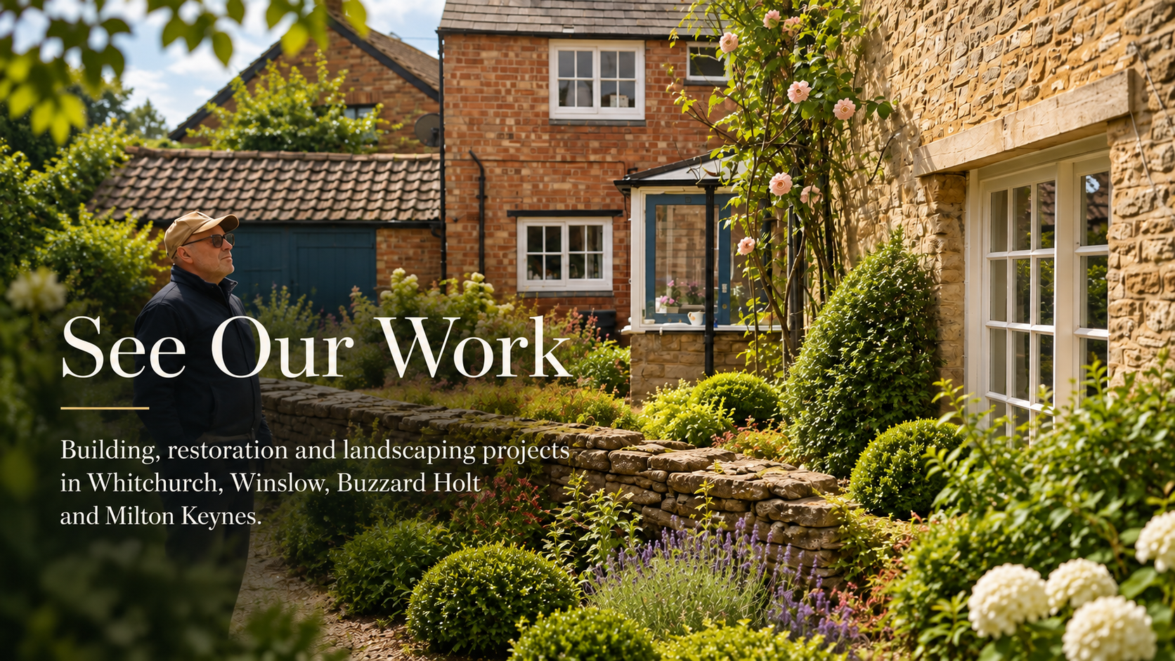 The owner of D Catt Builders in a restored cottage garden with brick and stone houses, a dry stone wall and roses
