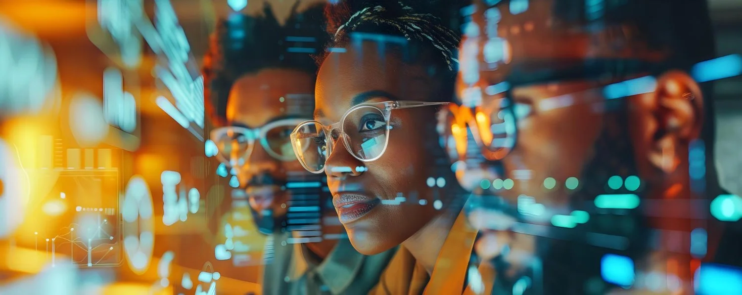 Two women looking at a futuristic digital display with holographic charts and graphs, in a high-tech environment.