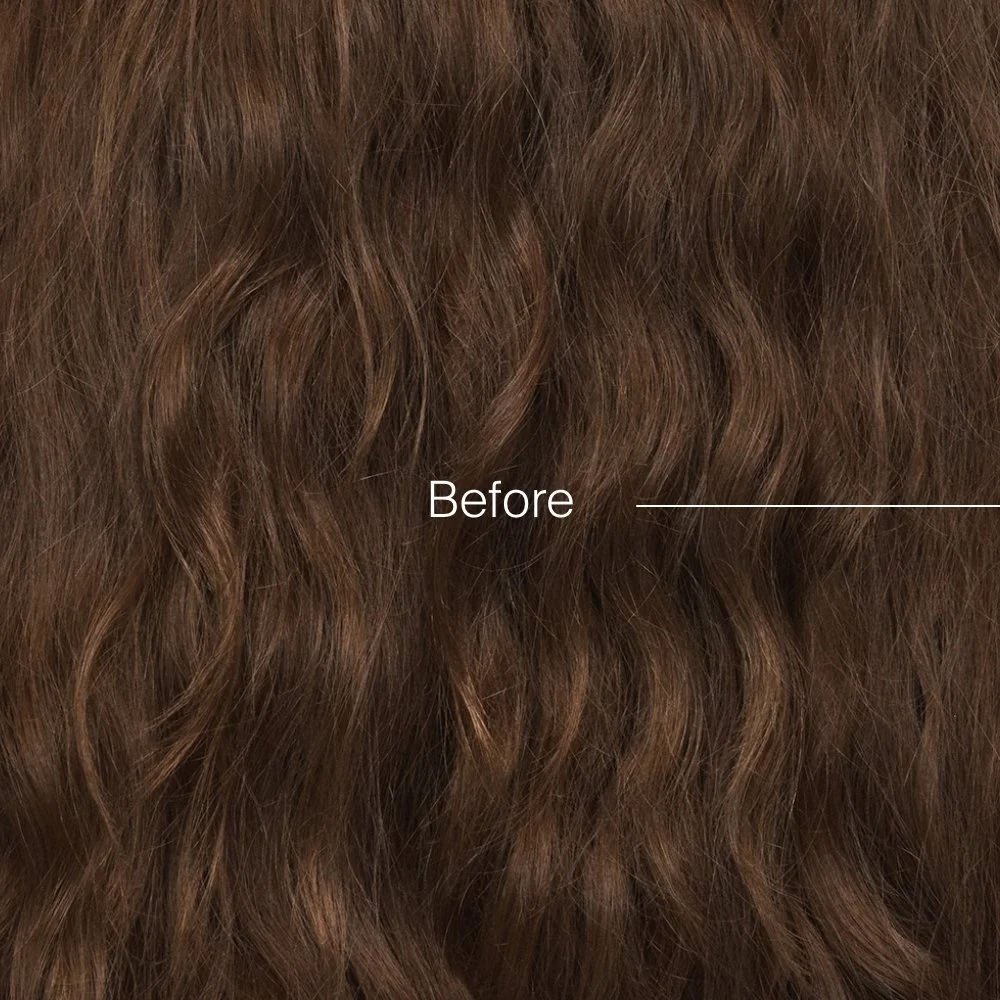 Close-up of wavy, reddish-brown hair with the word "Before" written on it.