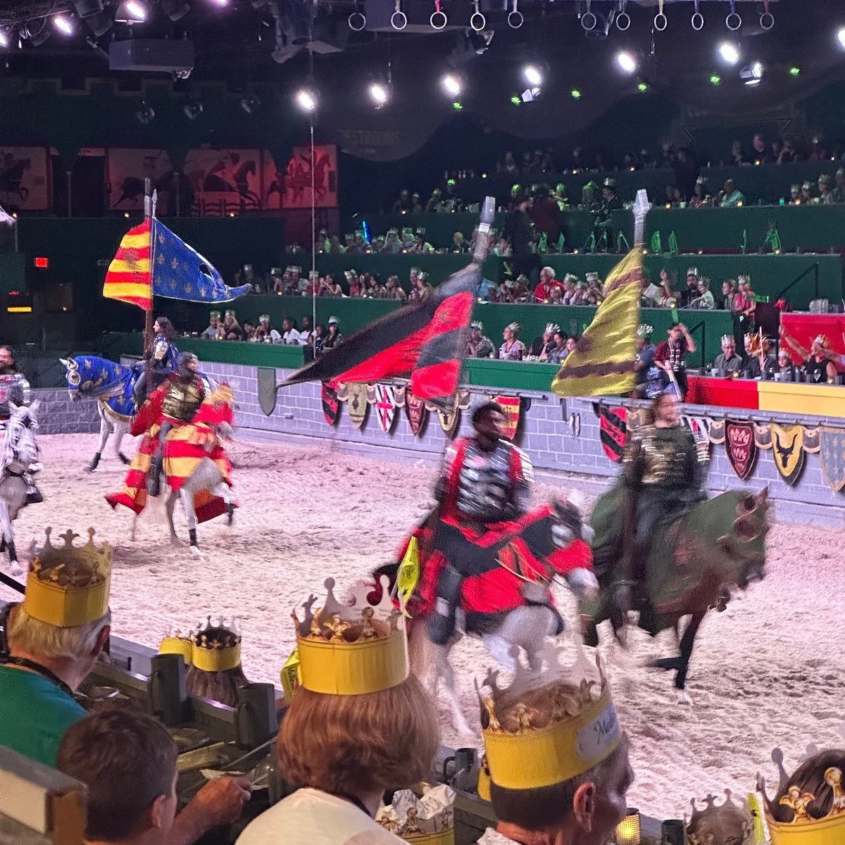 Medieval Times Dinner & Tournament in Kissimmee featuring knights jousting on horseback before an audience.