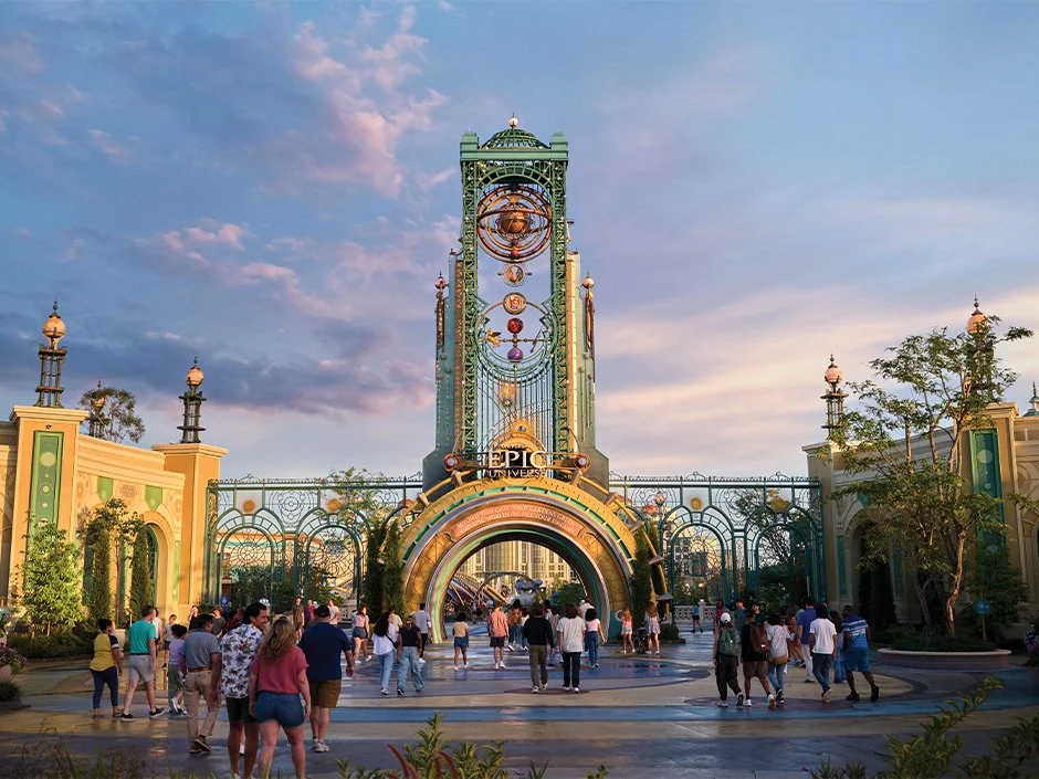 Entrance to Universal Epic Universe featuring the Chronos gateway at sunset.