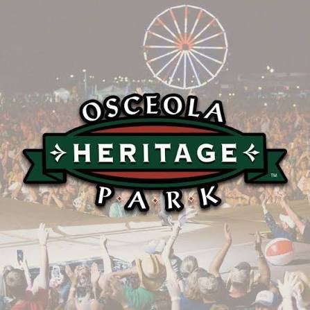 Concert crowd at Osceola Heritage Park in Kissimmee with a Ferris wheel in the background.