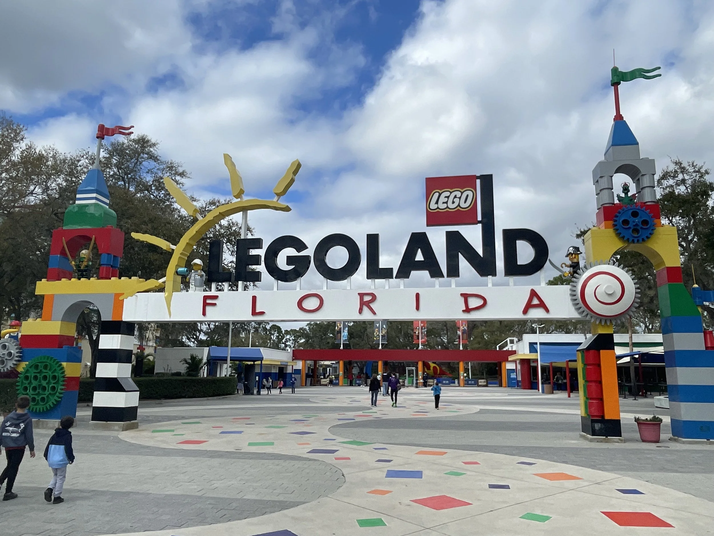 Colorful LEGOLAND Florida Resort entrance featuring LEGO structures and welcoming arches.
