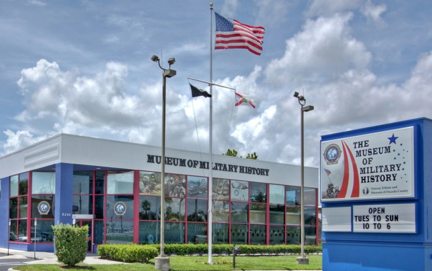 Exterior of the Museum of Military History in Kissimmee with American flags.