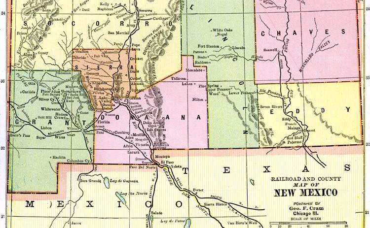 Map of New Mexico showing county divisions, cities, and geographical features, with color-coded regions and rail lines.