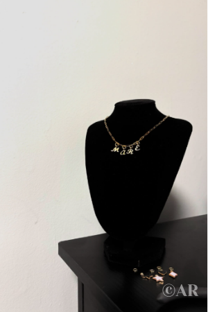 Charm necklace on neck mannequin